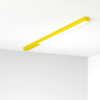 Żółta długa lampa montowana natynkowo.