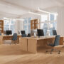 Office coworking interior with table and shelf, workspace near panoramic window